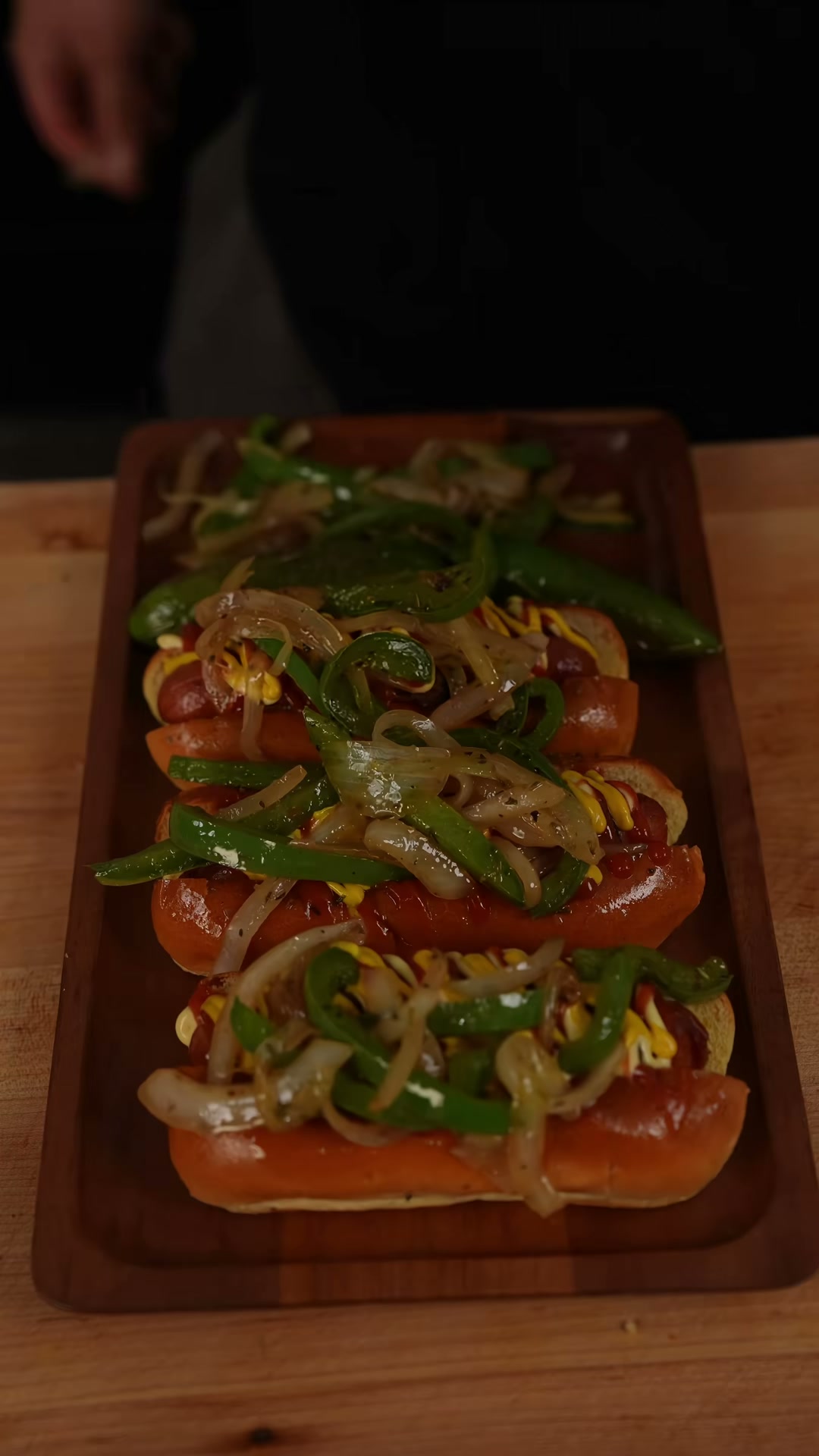 Bacon-Wrapped Hot Dogs With Sautéed Peppers And Onions